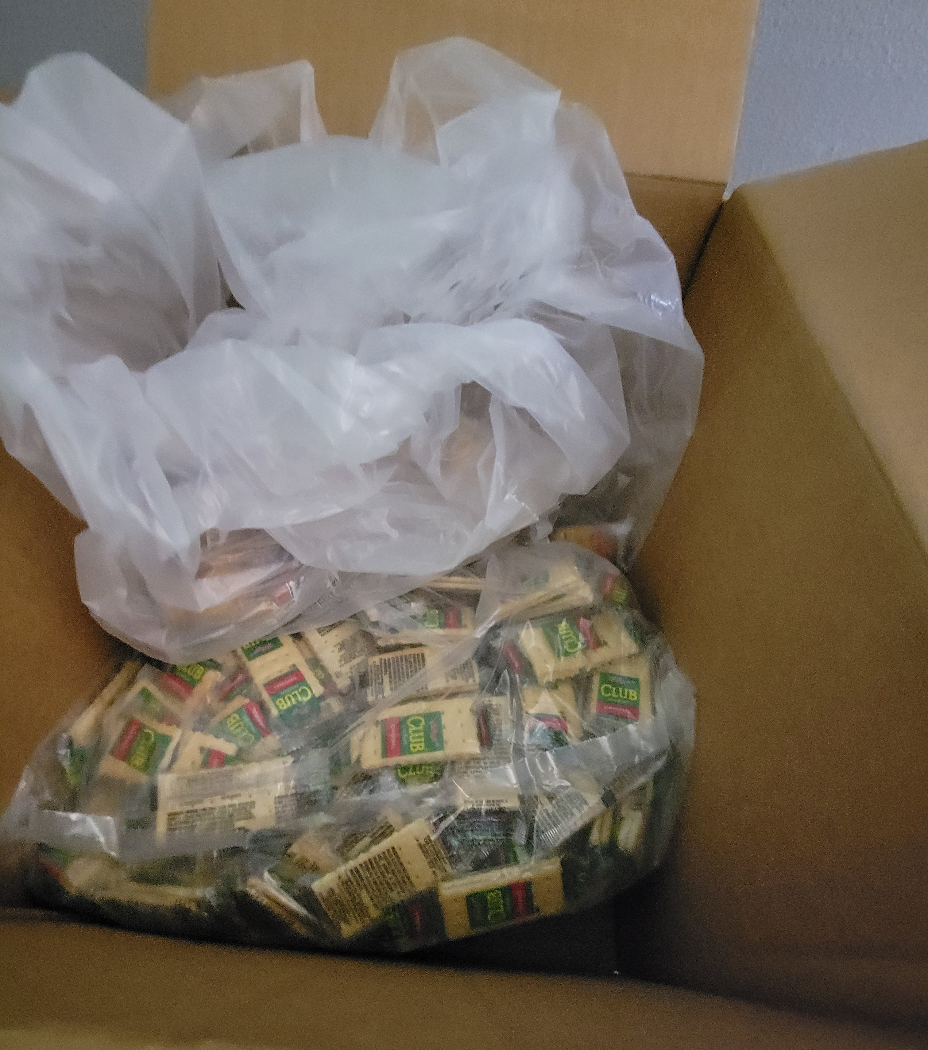 Cardboard box full of crackers.